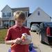 Griffin Bartscht, 9, feeds his guinea pig Hermione March 16, 2012, a day after a tornado tore a wall off his family's home in the Huron Farms neighborhood. Angela J. Cesere | AnnArbor.com 